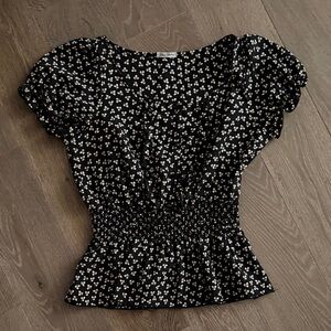 Women’s Blue Sketch black floral blouse. Size: Large. Gently Used.